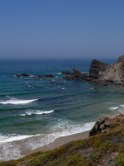 Empty beach with waves and blue water, paradise, in costa vicentina, alentejo, portugal	