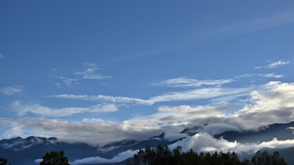 The mountains in the distance are covered in clouds.