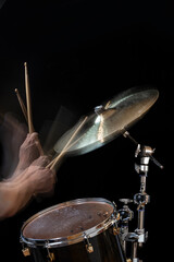 Fototapeta premium Stroboscopic drummer hitting cymbals with drum sticks