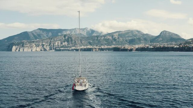 Aerial view on a yacht sailing on a sea