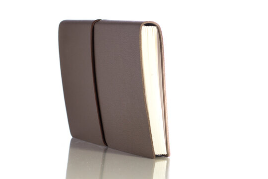 Isolated picture of a leather book over white background.