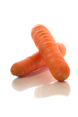 Delicious orange color carrot over white background.