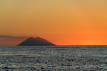 Fototapeta premium Beautiful sunset over Tyrrhenian Sea and Stromboli island viewed from Tropea, Calabria, Italy