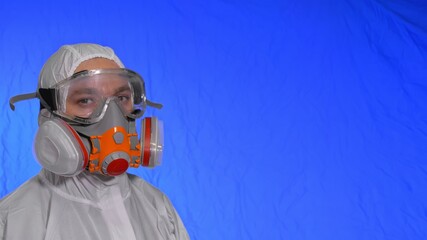 Scientist virologist in respirator. Slow motion. Man close up look, wearing protective medical...