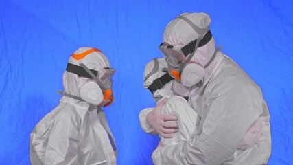 The family shield protect, to save life from virus. Slow motion. People portrait, wearing protect medical aerosol spray paint mask respirator. Concept health safety protection coronavirus epidemic.