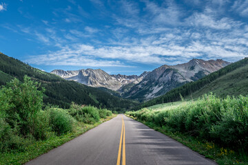 The Elk Mountains stand above the Ashcroft Ghost Town on Castle Creek Road near Aspen, Colorado and...