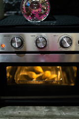 Air Fryer oven cooking food. Black Modern Electric Deep. Domestic Household & Small Kitchen Appliances.