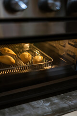 Cooking asian dish karipap or currypuff in the air fryer oven. A healthier way instead of frying in the oil.