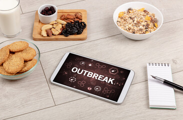 Healthy Tablet Pc compostion with OUTBREAK inscription, immune system boost concept