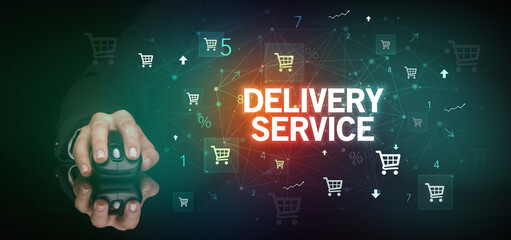 hand holding wireless peripheral with DELIVERY SERVICE inscription, online shopping concept