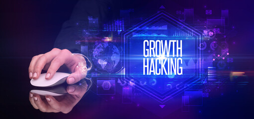 hand holding wireless peripheral with GROWTH HACKING inscription, cyber security concept