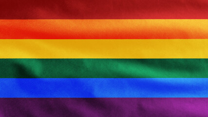 Pride gay flag waving in the wind. Close up of LGBT rainbow banner blowing.