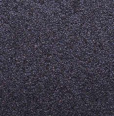 Pile of organic black sesame seeds isolated on white background