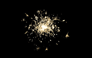 Burning sparkler celebration holiday festive fireworks glittering sparkle on black background