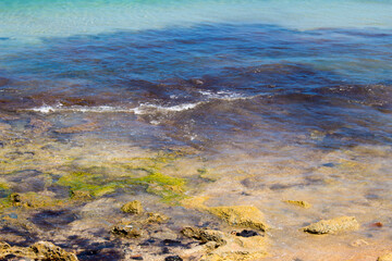 Scenic view of waves rolling in off shore at Ocean Beach Bunbury, Western Australia on a hot summer afternoon creates a splendid seascape with basalt rocks and sandy beaches.