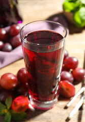 Delicious grape soda water on table. Refreshing drink