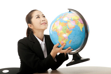 Business woman holding a globe