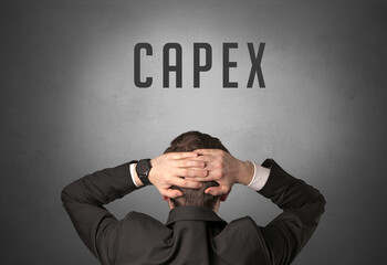Rear view of a businessman with CAPEX inscription, powerfull business concept