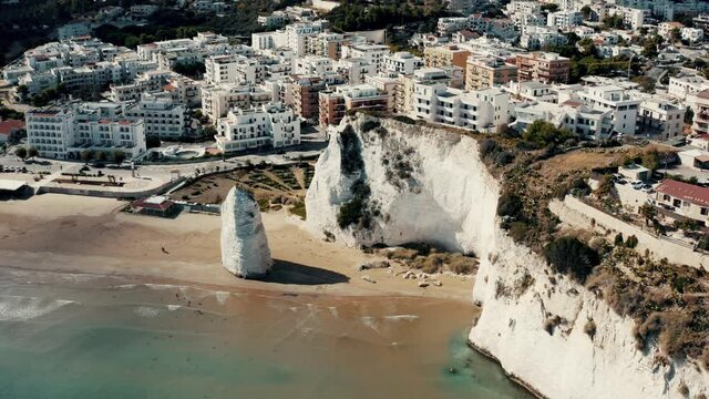 Aerial view on a Italian coast with town and beach.