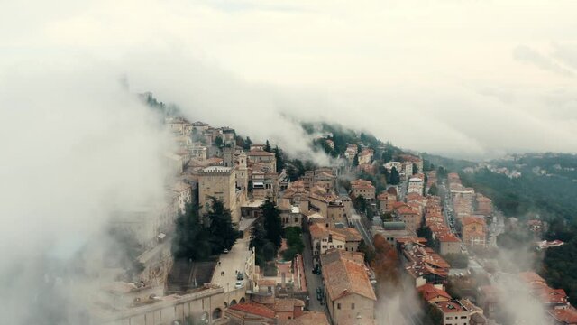 Aerial view on San Marino hidden in the clouds.