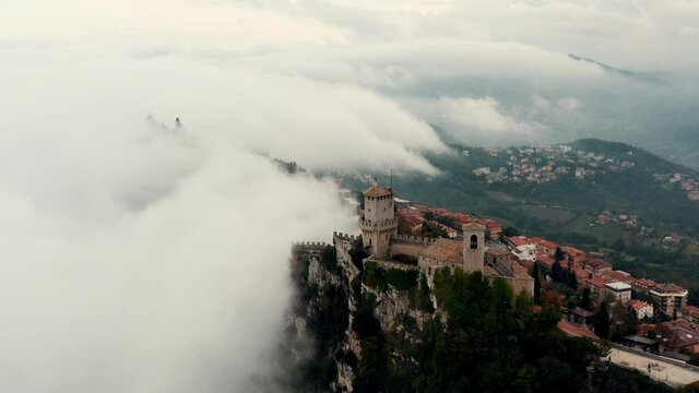 Aerial view on San Marino hidden in the clouds.