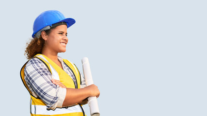 Portrait of African American woman architect wearing a vest and helmet on isolated background.
