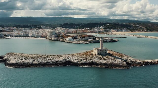 Aerial view on lighthouse on a small island in Italy.