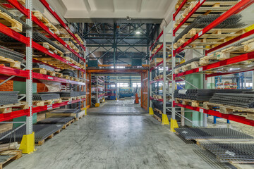 Factory warehouse steel reinforcement. High stacked shelving.