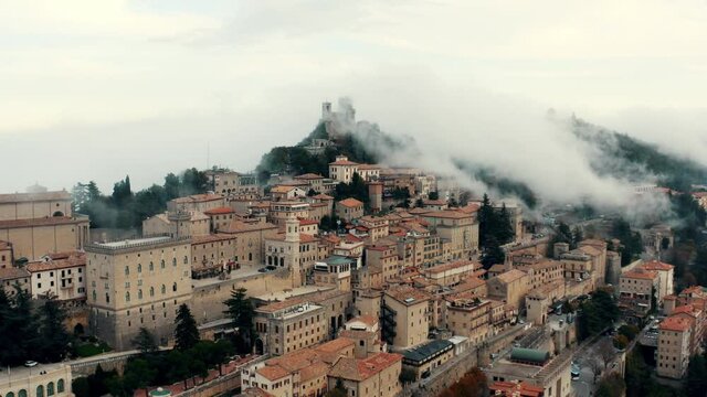 Aerial view on San Marino hidden in the clouds.