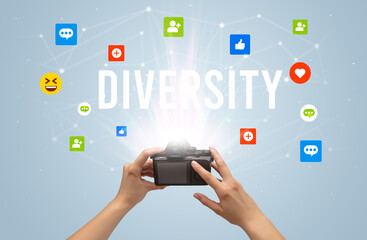 Using camera to capture social media content with DIVERSITY inscription, social media content concept