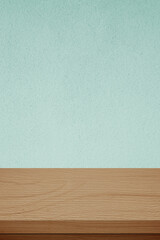 Vertical brown wood table and green cement wall background in kitchen, Wooden shelf, counter for food and product display in room background, Wood table top, desk surface banner, mockup, template