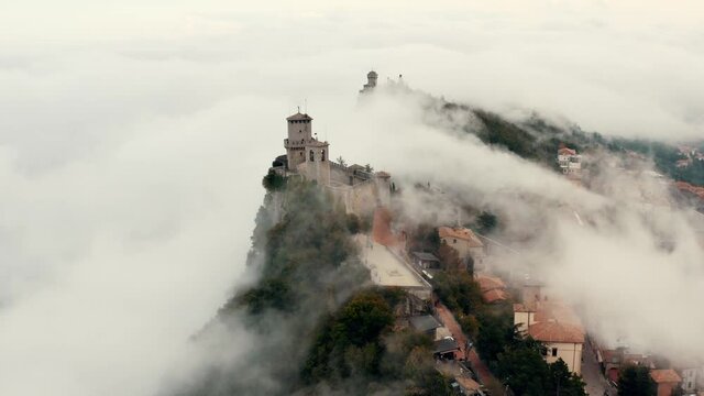 Aerial view on San Marino hidden in the clouds.