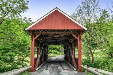 The historic red Erskine Covered Bridge crosses Middle Wheeling Creek in rural Washington County, Pennsylvania.