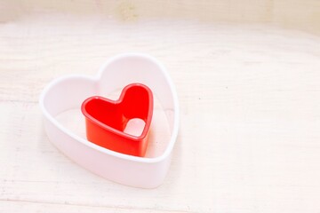Red heart is on wooden background for Valentine's Day