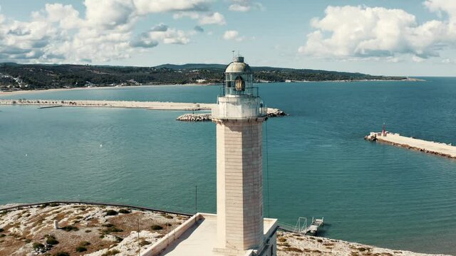 Aerial view on lighthouse on a small island in Italy.