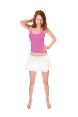 Full length portrait of an attractive laughing woman wearing a white miniskirt and a pink tank top, isolated on white studio background