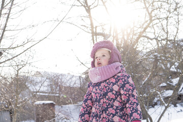 Winter, family, childhood concepts - authentic little preschool minor baby girl in pink warm...