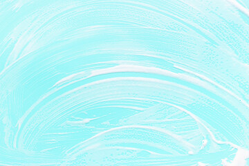 White foam on blue surface close-up, texture and background.