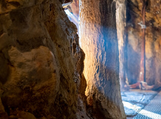 Sunrays illuminating cave at Sandanbeki Cliff in Shirahama, Wakayama Prefecture, Japan.