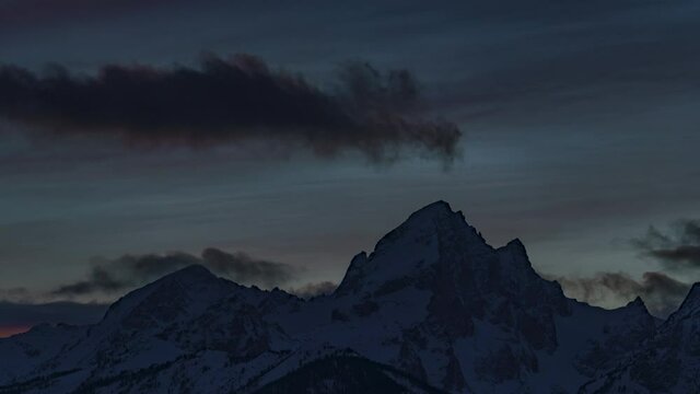 Closeup Timelapse of Sunset Clouds over Snow Capped Mountain Peaks of Grand Teton National Park
