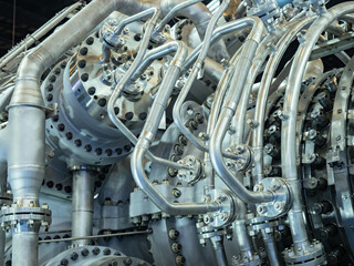 Industrial equipment. Background consists of a production compressor. Chrome plated compressor with...