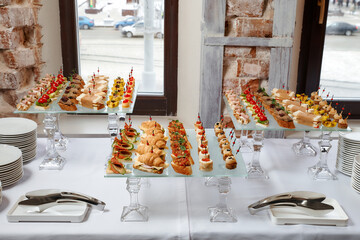 Сatering. Banquet table with different snacks and desserts