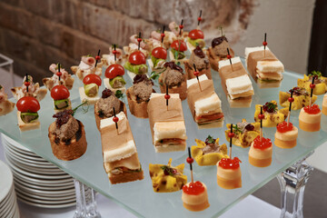 Сatering. Banquet table with different snacks and desserts