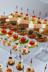 Сatering. Banquet table with different snacks and desserts