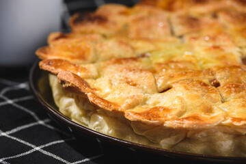 apple pie on a wooden background. Rustic style.