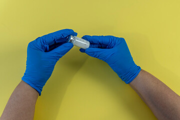 Flat Lay for medical theme and vaccinations from COVID-19. Medicine, vaccine, syringe, hands of a...