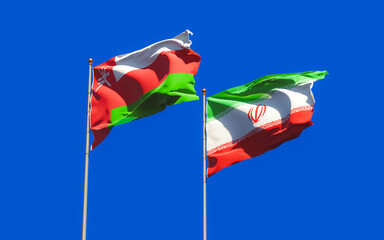 Flags of Oman and Iran.