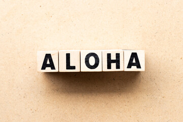 Letter block in word aloha on wood background © bankrx