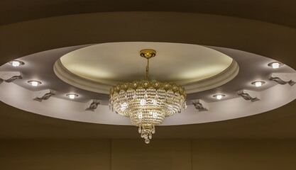 Interior details with ceiling chandelier and lamps