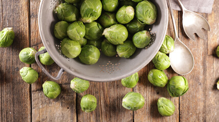 raw brussels sprouts on wood background